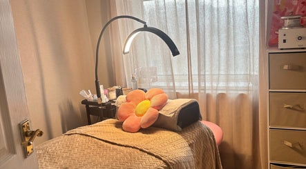 Tranquil treatment room at Brows: By Hazel Bromiley, Chorley, England, GB, featuring a cozy bed and soft lighting.