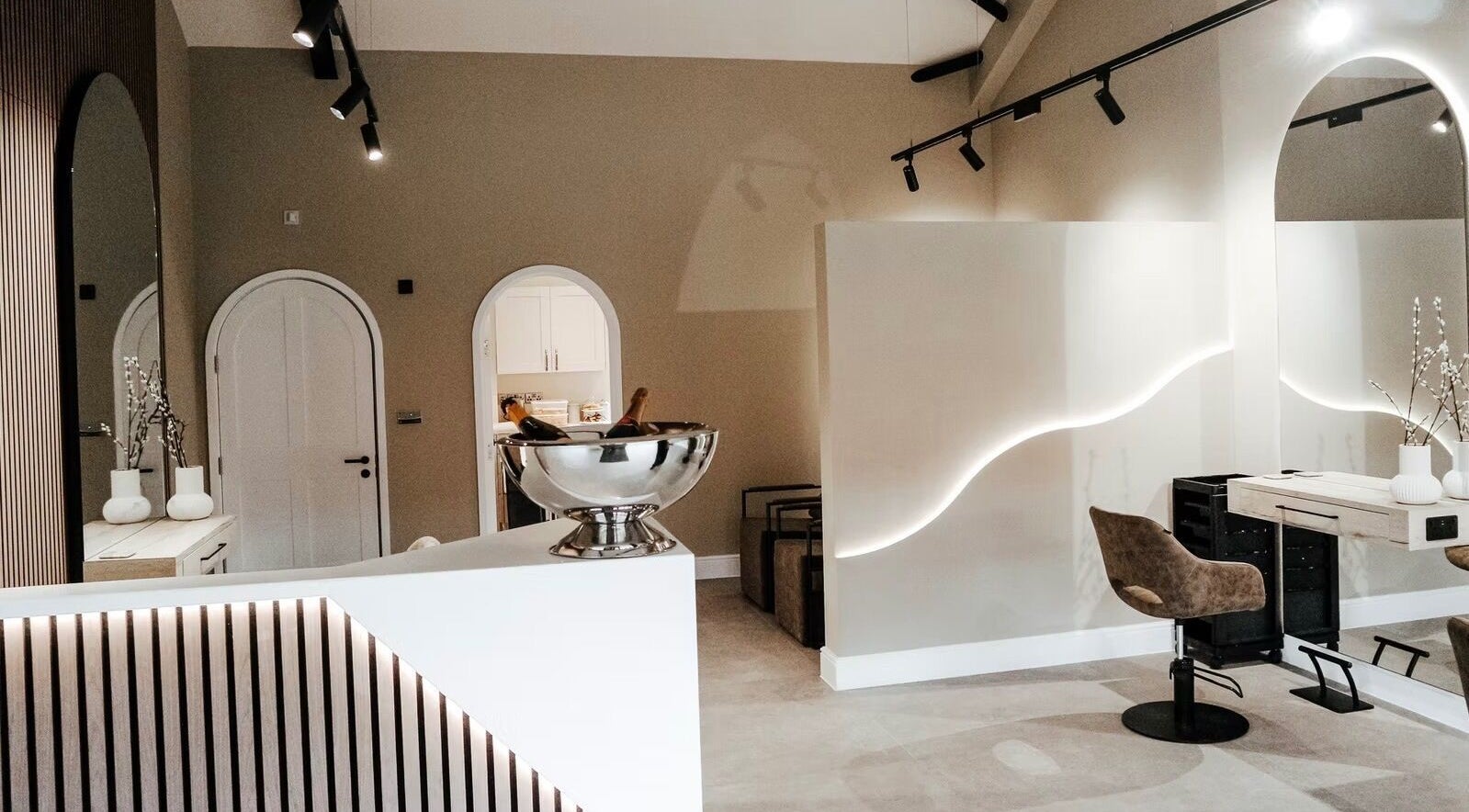 Modern interior of Hair By Mia Mulford, Shrewsbury, England, GB, featuring sleek mirrors and stylish seating.