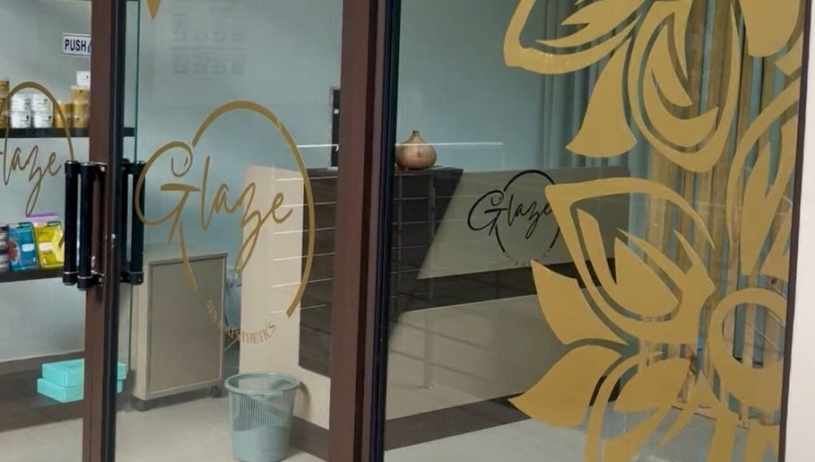 Entrance of Glaze Beauty Studio in Lusaka, Lusaka Province, ZM, showcasing stylish glass door design.