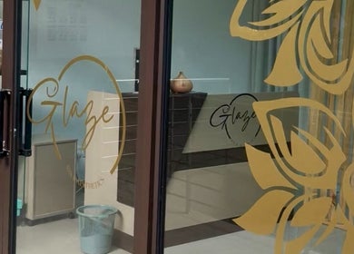 Entrance of Glaze Beauty Studio in Lusaka, Lusaka Province, ZM, showcasing stylish glass door design.