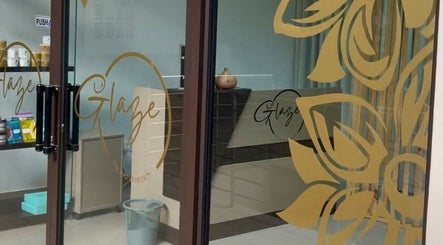 Entrance of Glaze Beauty Studio in Lusaka, Lusaka Province, ZM, showcasing stylish glass door design.