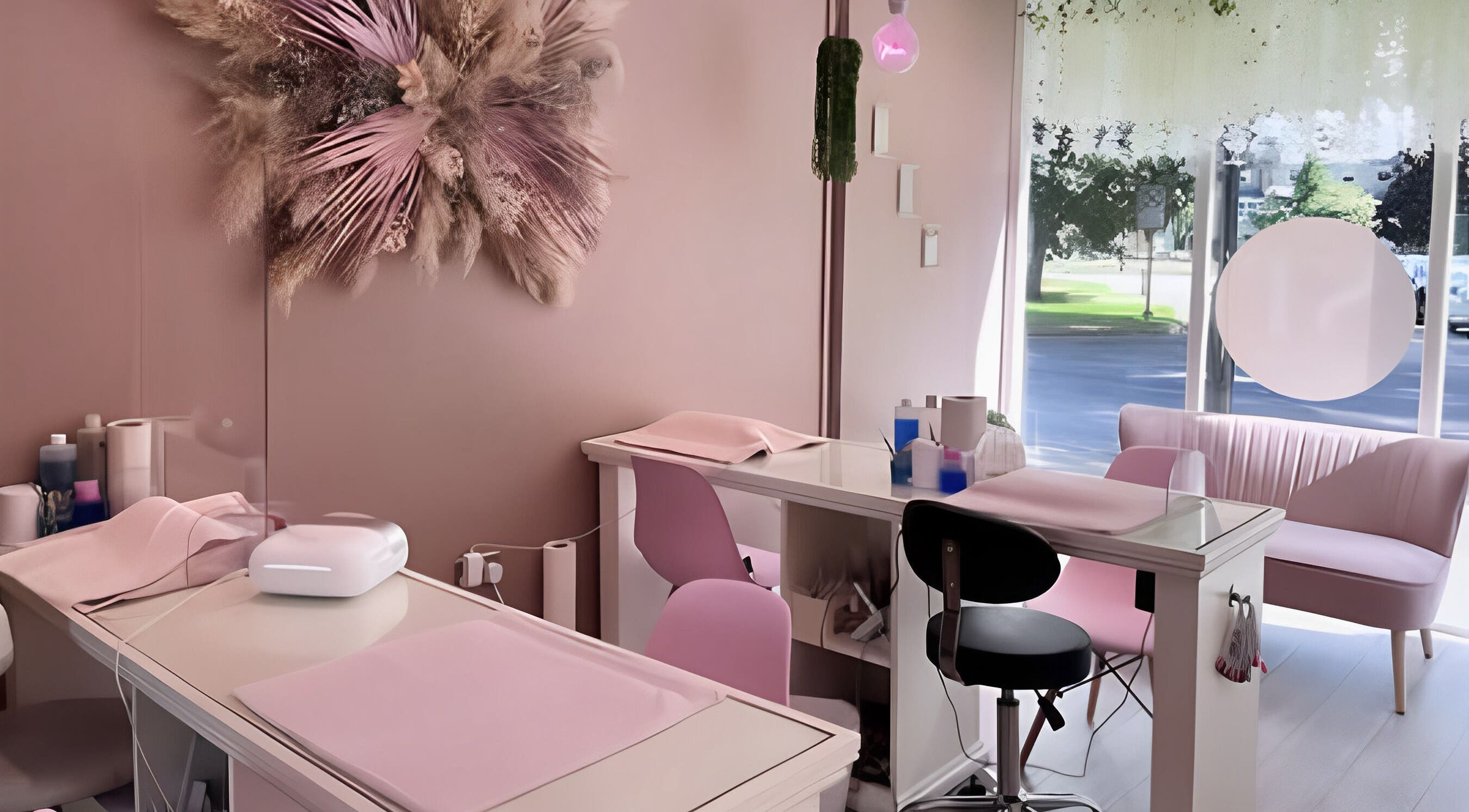 Stylish interior of The Nail Lounge by Poppie, Harrogate, England, GB with pink seating and floral decor.