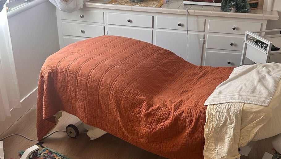 Relaxing treatment room at Donna Cherie Aesthetics, Santa Cruz, California, US with an inviting massage table.