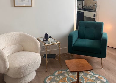 Elegant seating area at Donna Cherie Aesthetics, Santa Cruz, California. Features plush chairs and stylish decor.