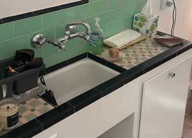 Sleek washbasin setup at Donna Cherie Aesthetics, Santa Cruz, California, US featuring aromatic candles.