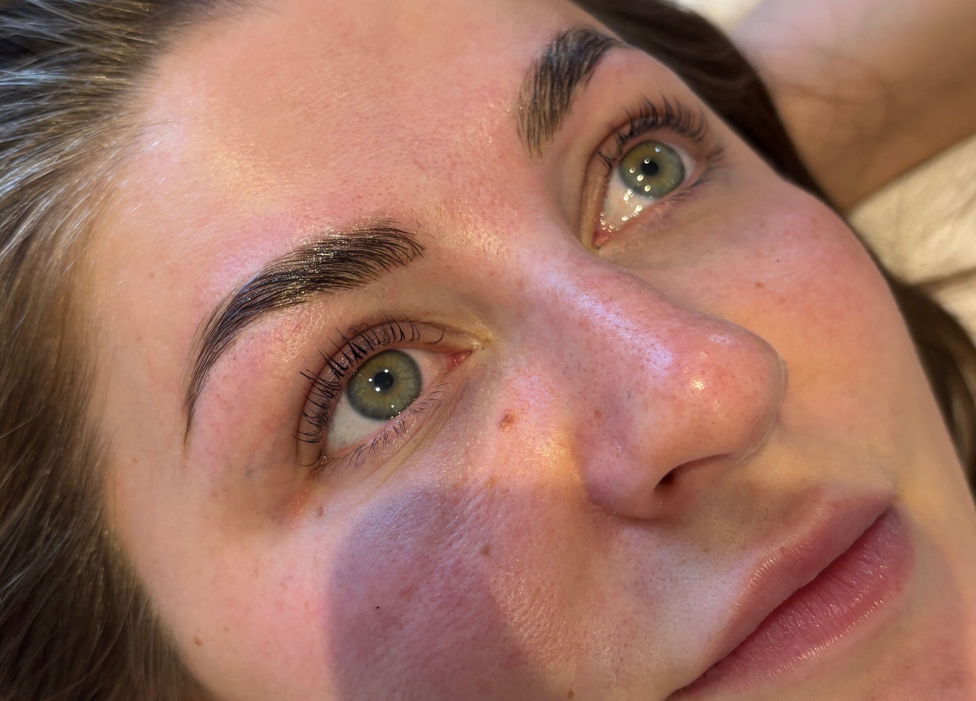 Close-up of a serene face highlighting perfect brows at _byaimeececcarelli, Bristol, England, GB.