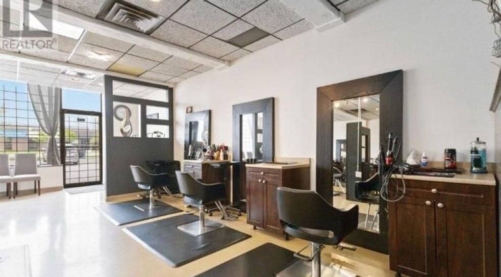 Modern styling stations at Sarita Salon n Spa Ltd., London, Ontario, CA, offering chic beauty services.