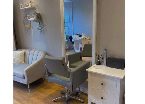 Cozy salon interior at Hair by Heather, Crieff, Scotland, GB featuring stylish chairs and light decor.