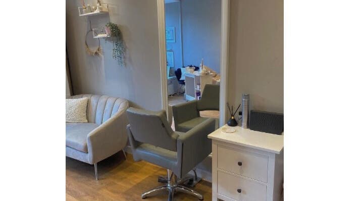 Cozy salon interior at Hair by Heather, Crieff, Scotland, GB featuring stylish chairs and light decor.