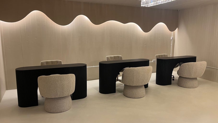 Luxurious seating at Glossed Clinic in Sturry, England, GB, showcasing modern elegance and comfort.