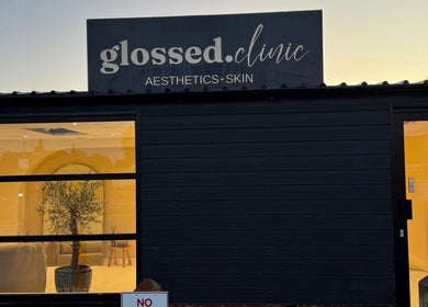 Exterior view of Glossed Clinic in Sturry, England, showcasing entrance and signage.