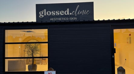 Exterior view of Glossed Clinic in Sturry, England, showcasing entrance and signage.