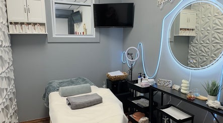 Cozy treatment room at Anástasis Beauty in Brooklyn, USA, US, featuring a massage bed and elegant decor.