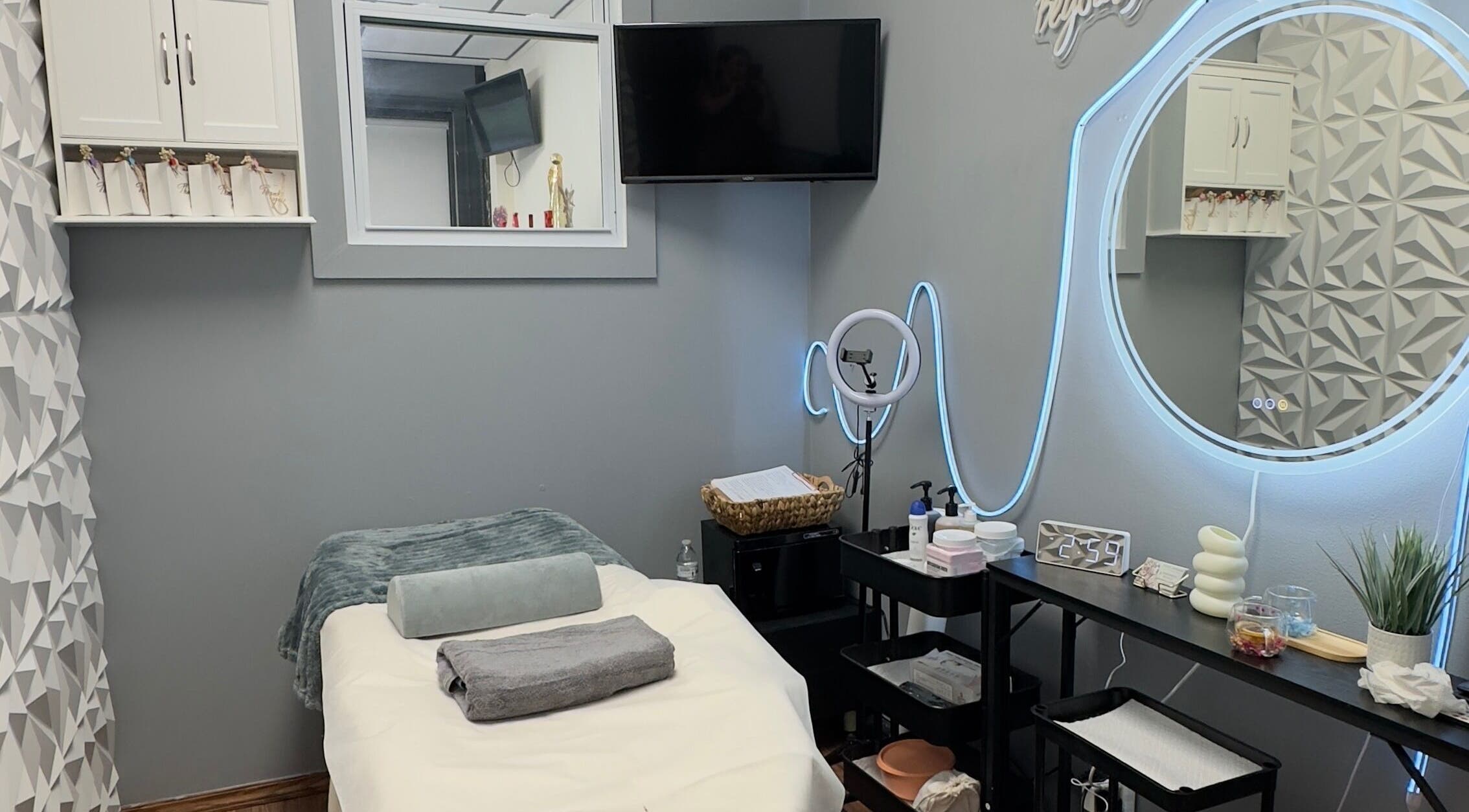 Cozy treatment room at Anástasis Beauty in Brooklyn, USA, US, featuring a massage bed and elegant decor.