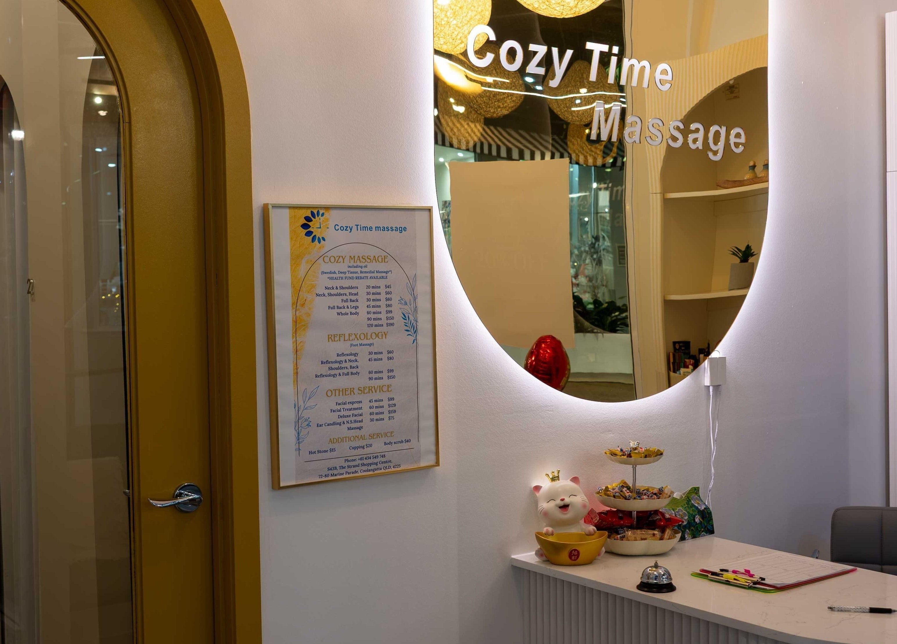 Entrance to Cozy Time Massage in Coolangatta, Queensland, AU with inviting decor and service menu.