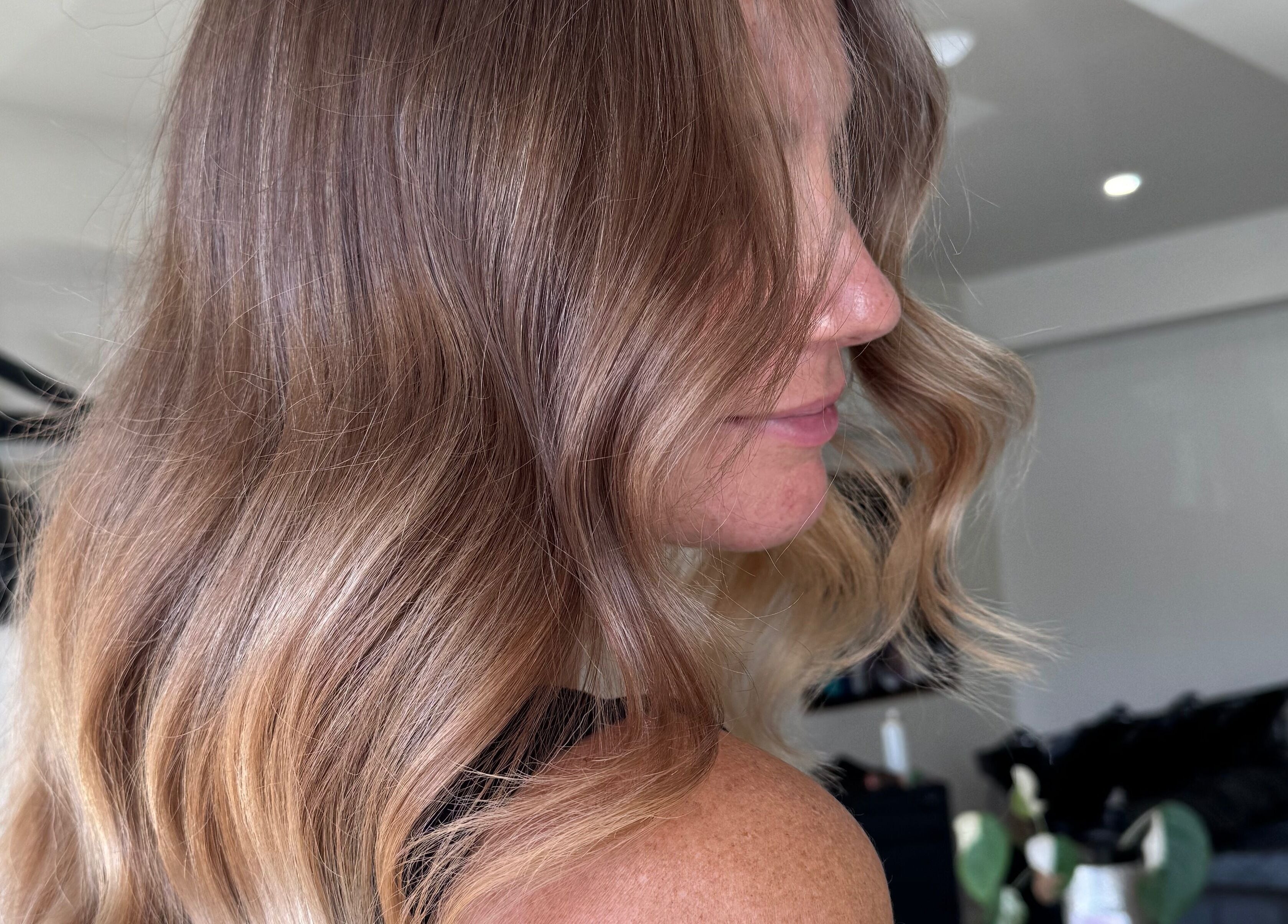 Elegant wavy hairstyle at Beachcomber Hairsalon, Ulladulla, New South Wales, AU, capturing salon's stylish allure.