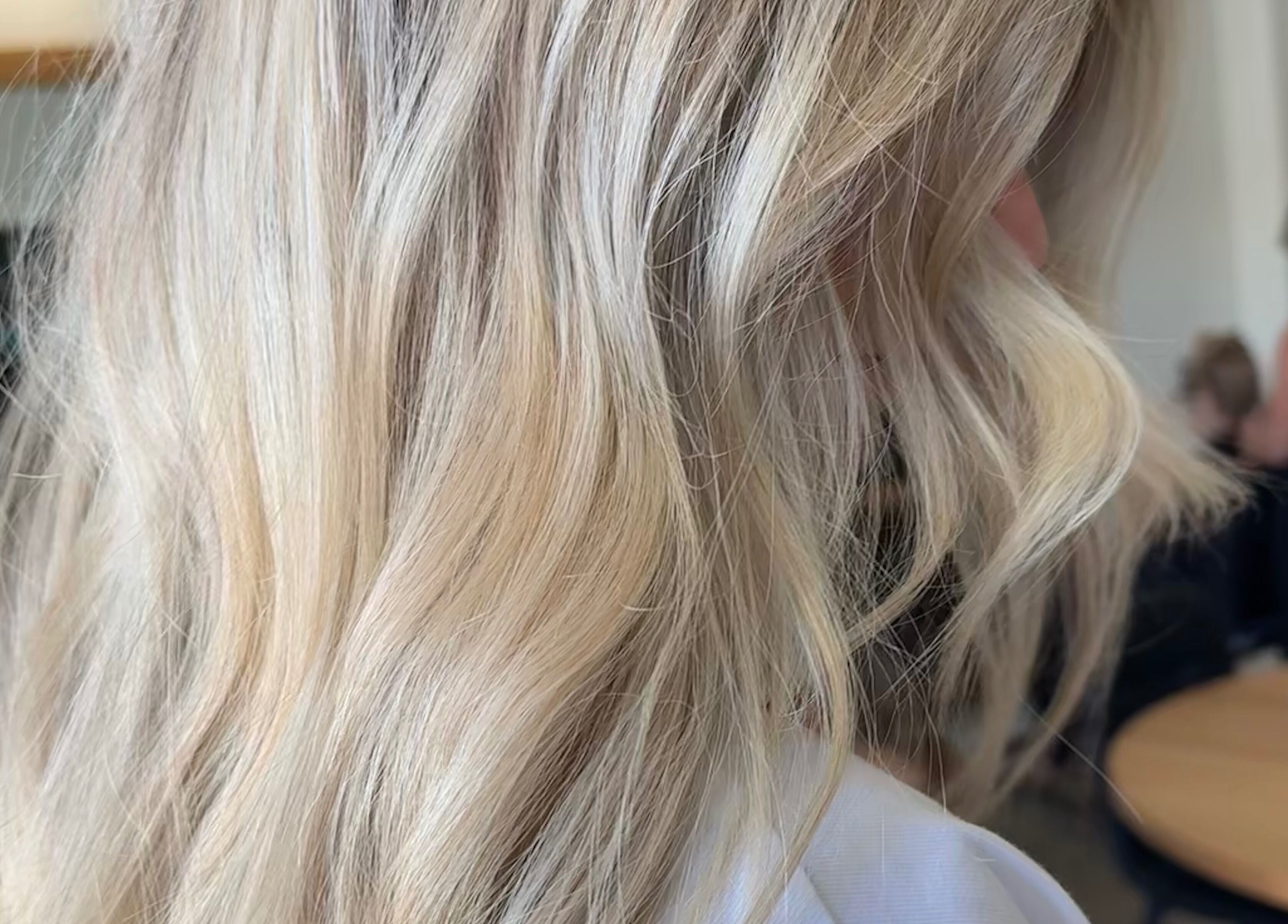 Blonde wavy hair styled at Beachcomber Hairsalon, Ulladulla, New South Wales, AU, showcasing expert styling.