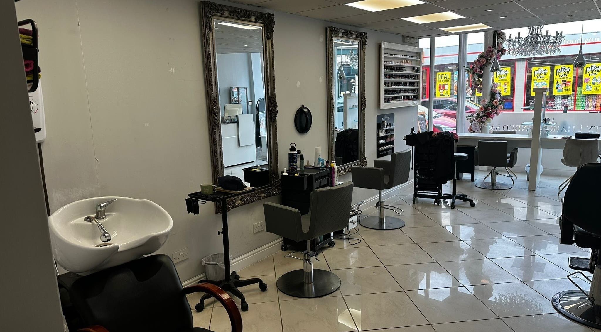 Modern salon interior at Mlinko hair in Bournemouth, England, GB with elegant chairs and mirrors.