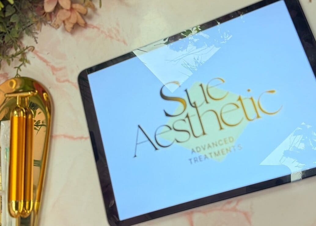 Elegant tablet with Sue Aesthetic logo and golden decor at Whitburn, England, GB.