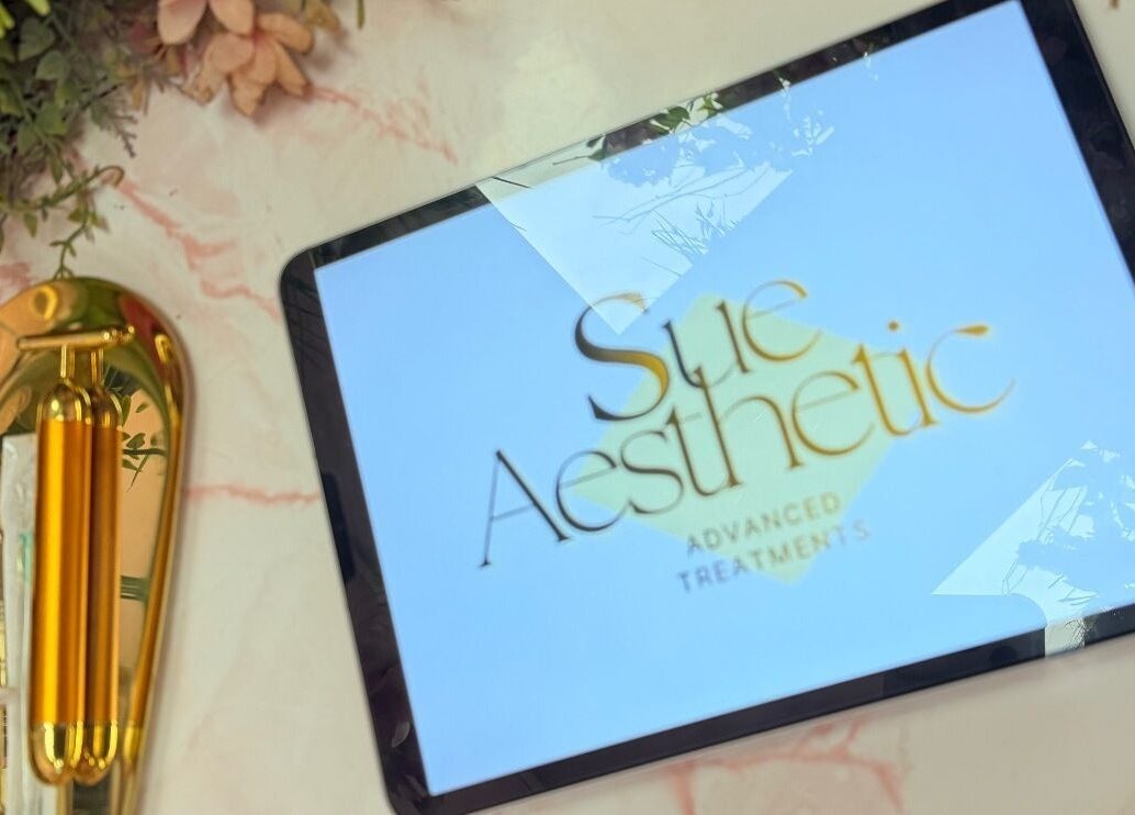 Elegant tablet with Sue Aesthetic logo and golden decor at Whitburn, England, GB.