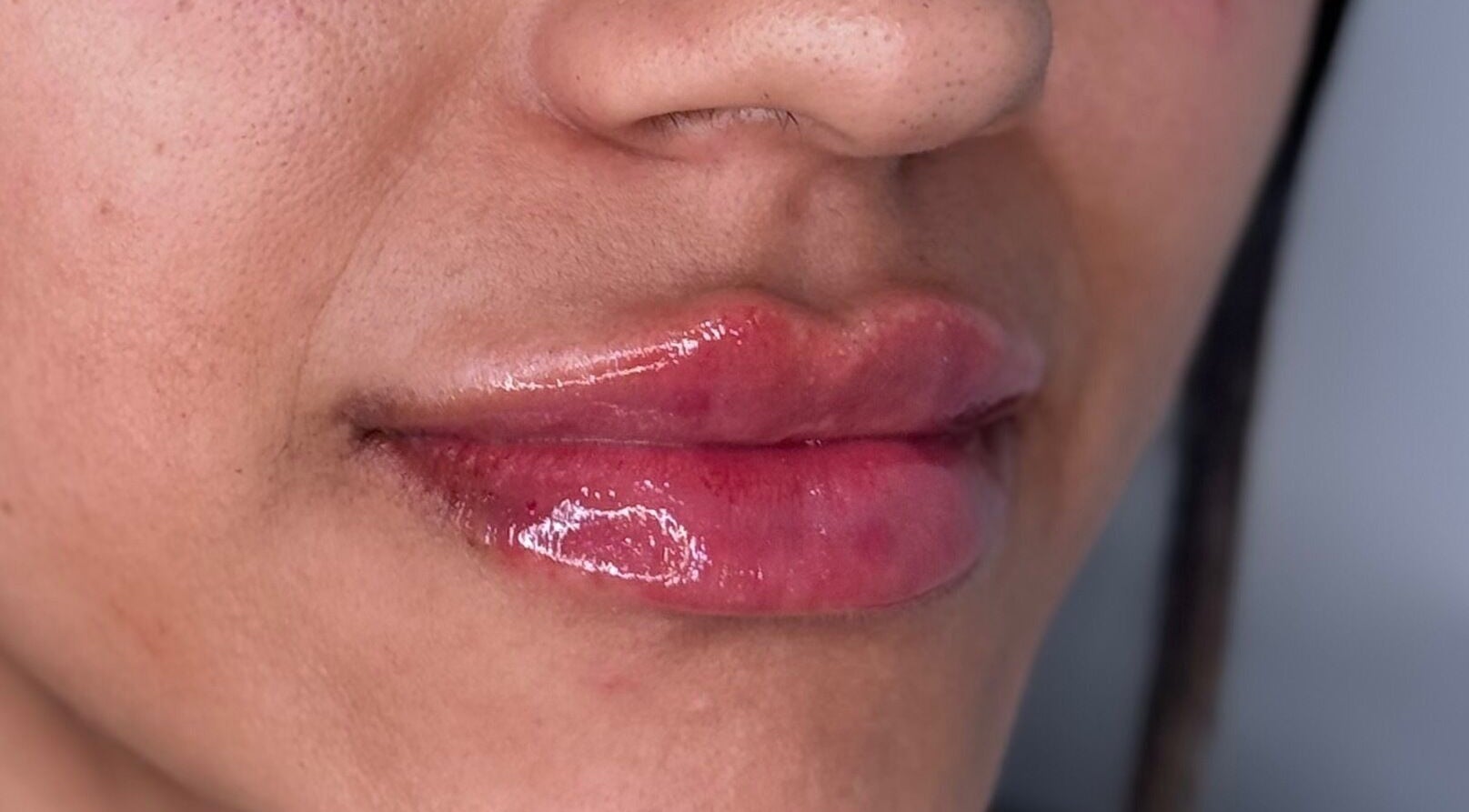 Close-up of glossy enhanced lips at Sue Aesthetic, Whitburn, England, GB, showcasing expert lip treatment.