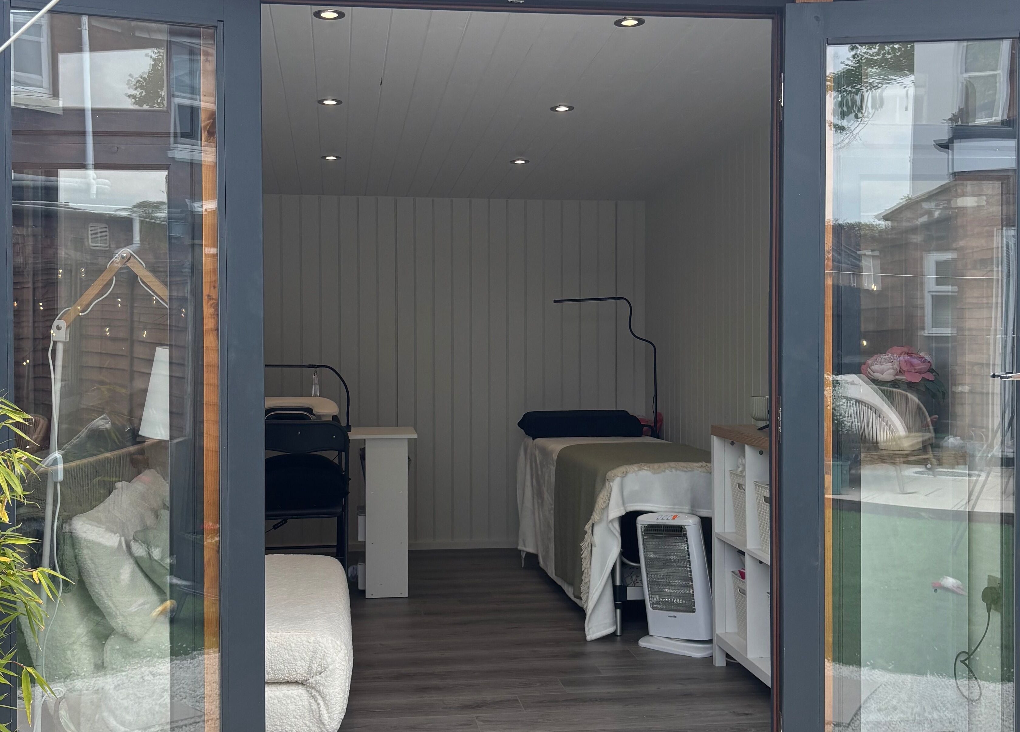 Inside The Beauty Cabin in Royal Leamington Spa, England. Cozy treatment beds and tranquil decor.