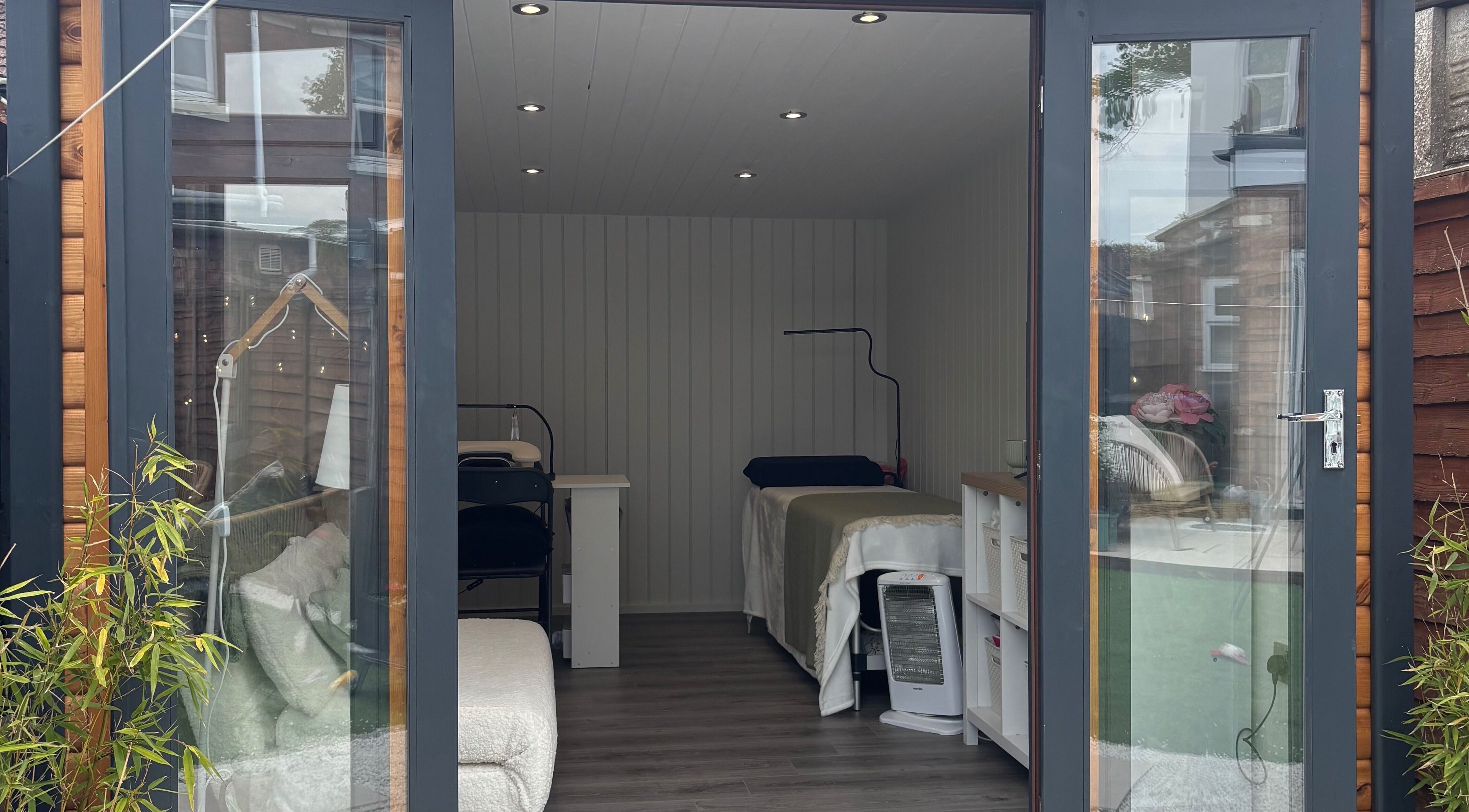 Inside The Beauty Cabin in Royal Leamington Spa, England. Cozy treatment beds and tranquil decor.