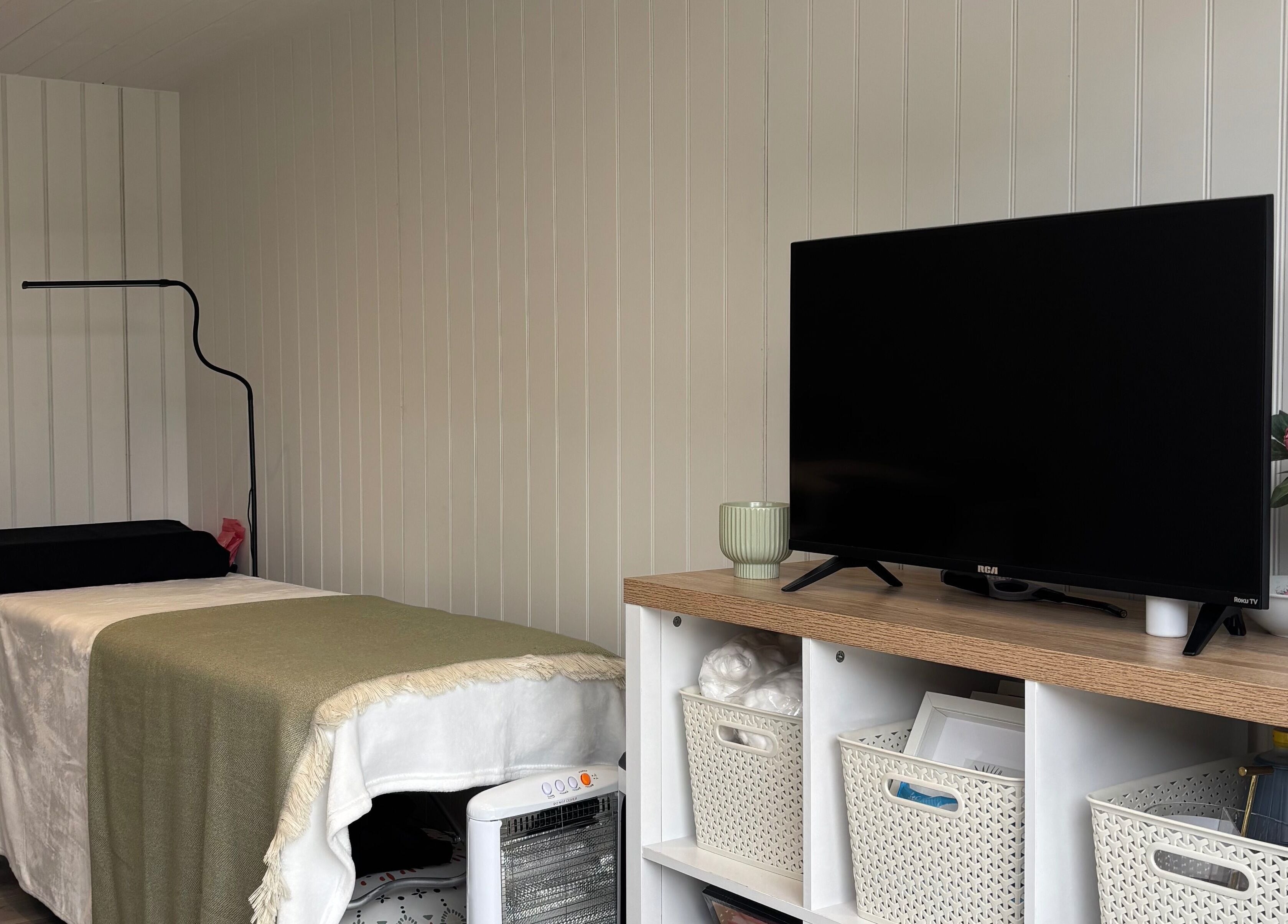 Relaxing treatment room at The Beauty Cabin, Royal Leamington Spa, England, GB with cozy decor.