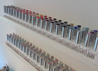Vibrant gel nail polish display at The Cherry Lounge, Boughton Monchelsea, England, GB.