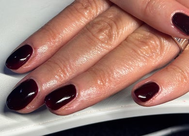 Elegant burgundy manicure at The Cherry Lounge, Boughton Monchelsea, England, GB, showcasing polished nails.