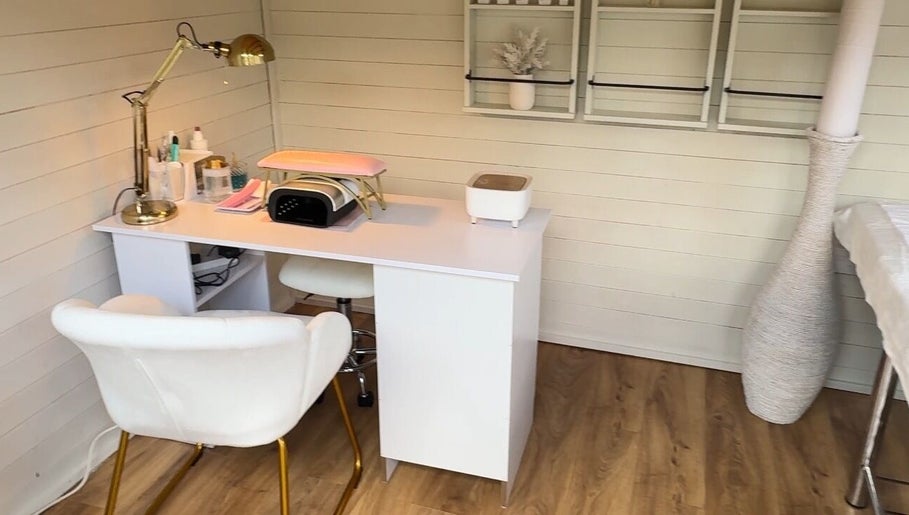 Belle Lily Beauty's manicure station in Aspley Guise, England, GB, featuring modern decor and comfortable seating.