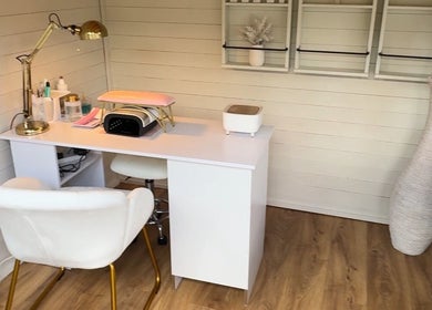 Belle Lily Beauty's manicure station in Aspley Guise, England, GB, featuring modern decor and comfortable seating.