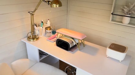 Cozy nail treatment corner at Belle Lily Beauty, Aspley Guise, England, GB, featuring a stylish lamp and equipment.