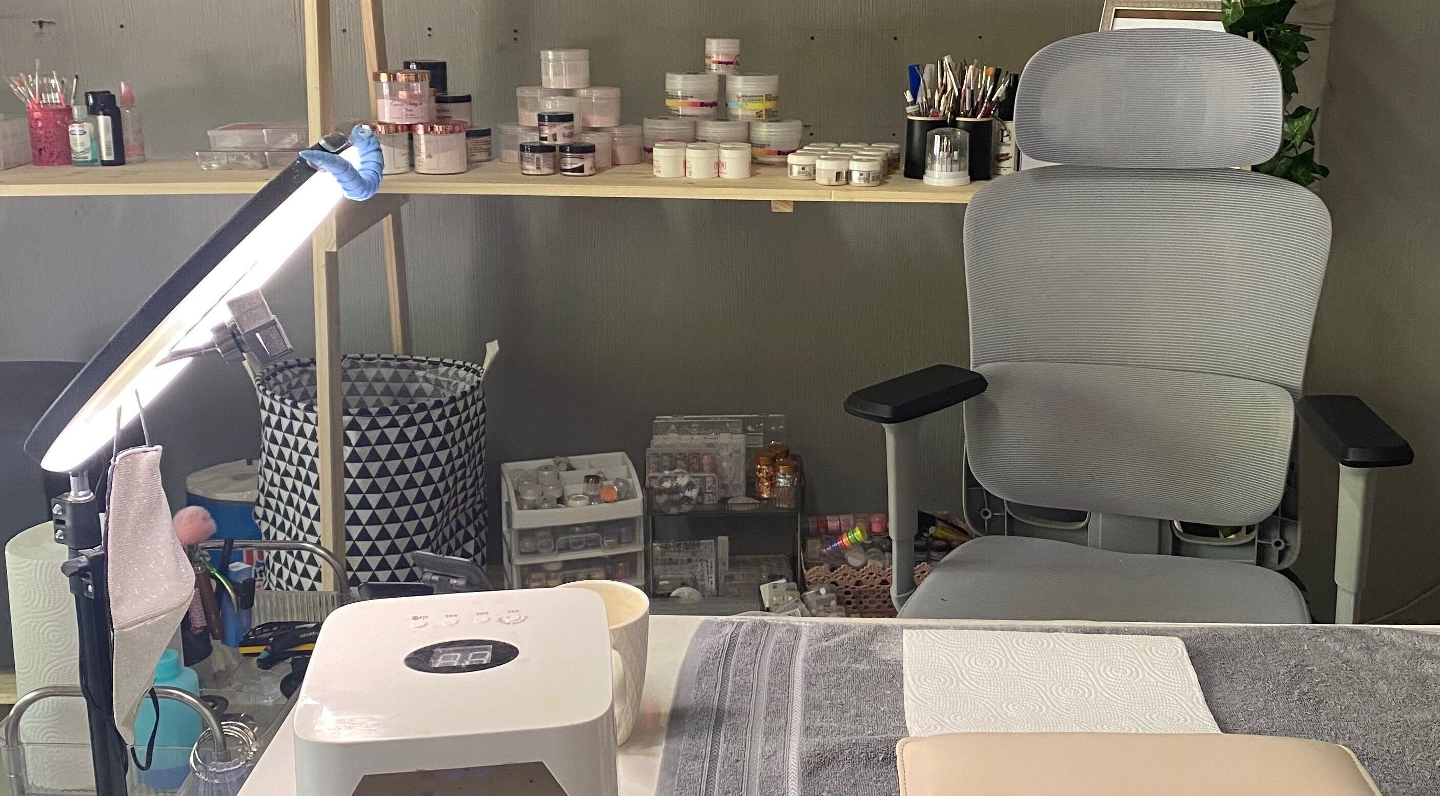 Professional nail setup at Sculpted by Monique, Kempton Park, Gauteng, ZA. Neat workspace with essential tools.
