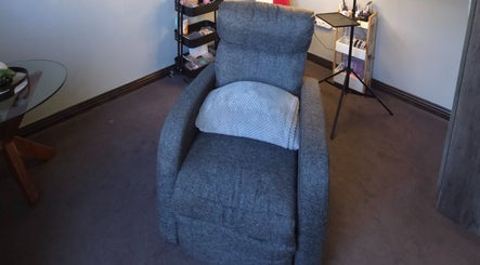 Comfortable gray recliner at The Lash Room Aspen, Johannesburg, Gauteng, ZA, providing a relaxing atmosphere.