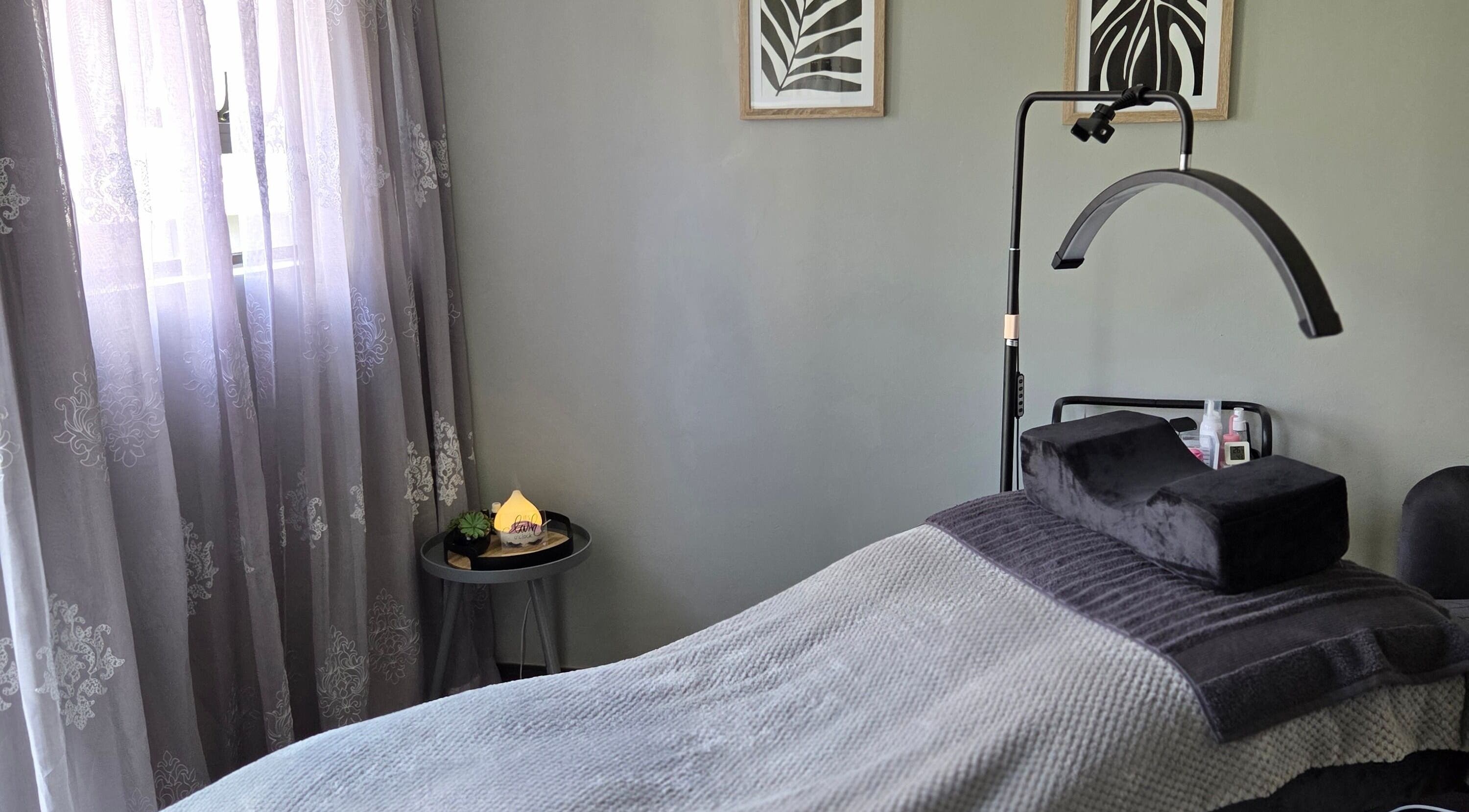 Cozy treatment bed at The Lash Room Aspen, Johannesburg, Gauteng, ZA with elegant decor and soft lighting.