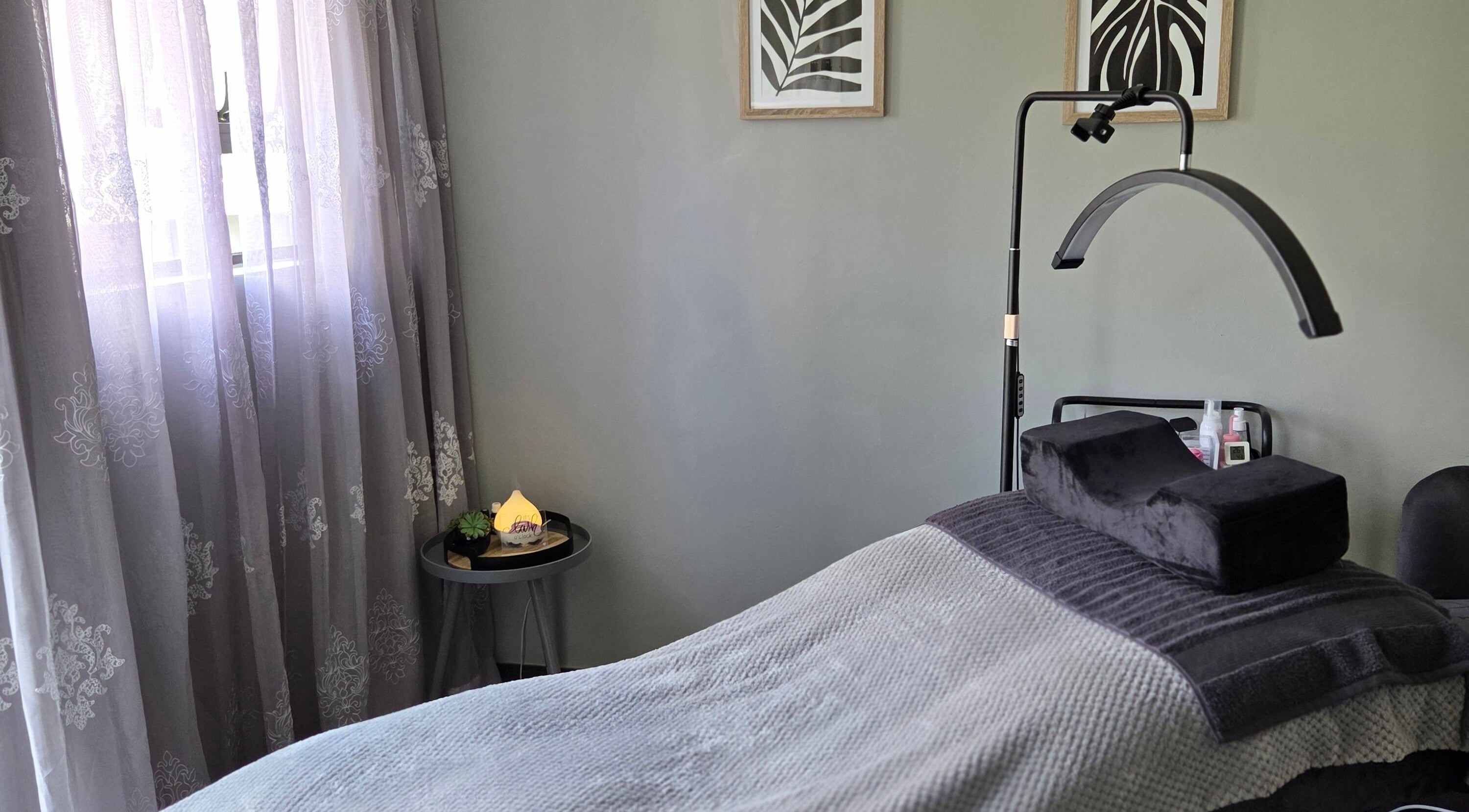 Cozy treatment bed at The Lash Room Aspen, Johannesburg, Gauteng, ZA with elegant decor and soft lighting.
