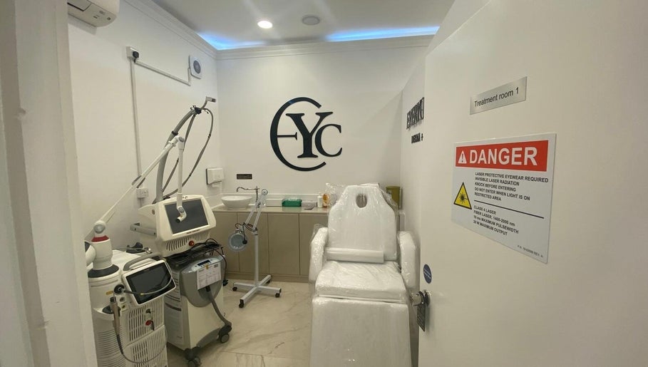 Modern treatment room at EverYoung Medical Aesthetics Clinic, London, England, GB, featuring advanced laser equipment.