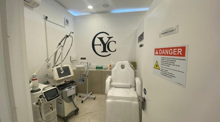 Modern treatment room at EverYoung Medical Aesthetics Clinic, London, England, GB, featuring advanced laser equipment.