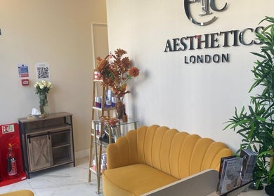 Bright, welcoming lounge at EverYoung Medical Aesthetics Clinic, London, England, GB, featuring yellow seating.