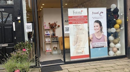 Entrance of EverYoung Medical Aesthetics Clinic in London, England, GB with promotional displays and decor.