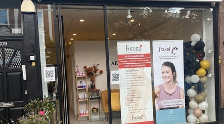 Front view of EverYoung Medical Aesthetics Clinic in London, England, GB, showcasing entrance and promotional banners.