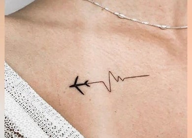 Unique airplane and heartbeat tattoo at Vault Tattoo in Harleysville, Pennsylvania, US.