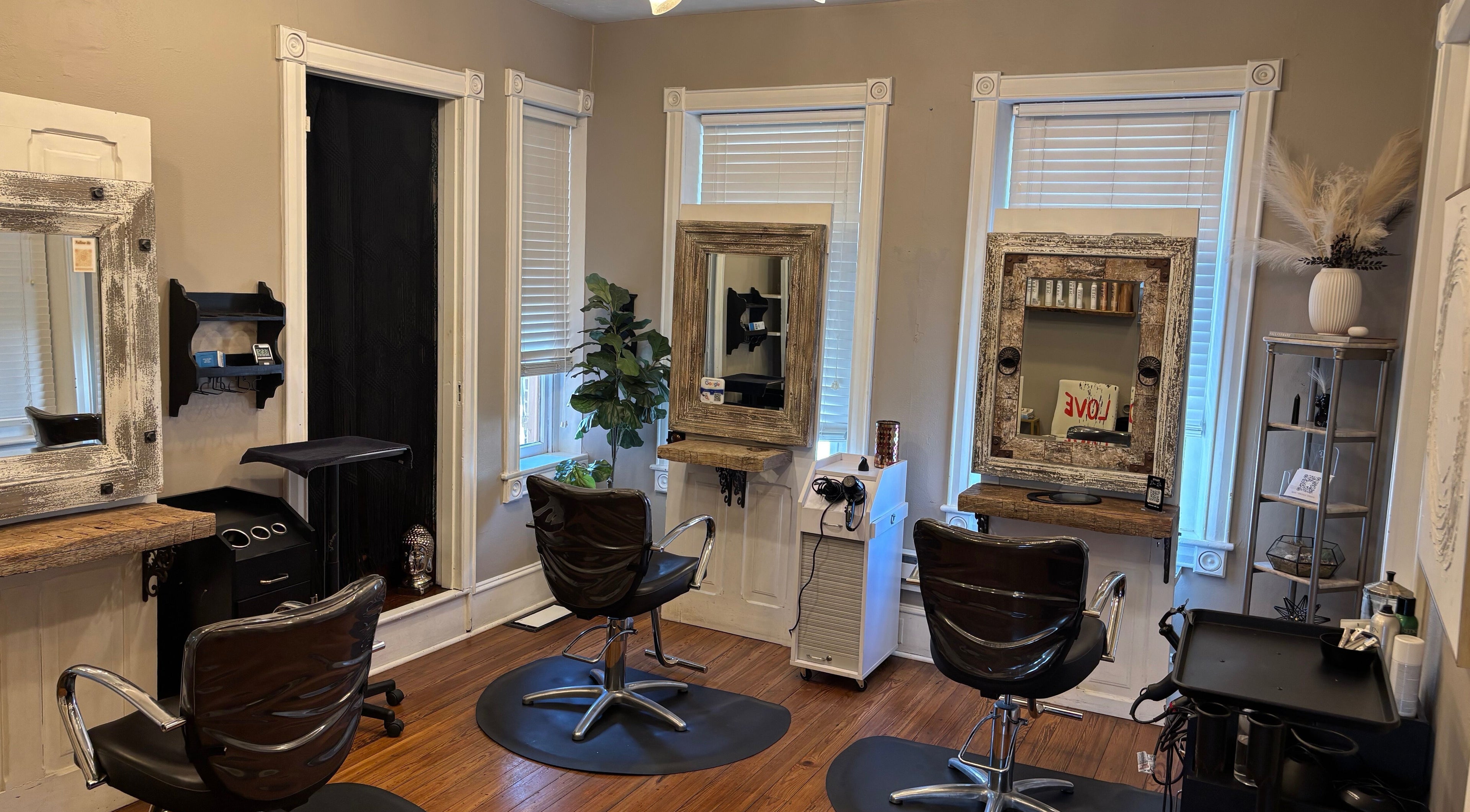 Elegant salon space at Prodigo Day Spa & Salon, Harleysville, Pennsylvania, US with stylish chairs and mirrors.