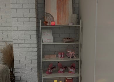 A calming shelf display at Elóre Beauty, Lawnton, Queensland, AU showcasing candles and beauty products.