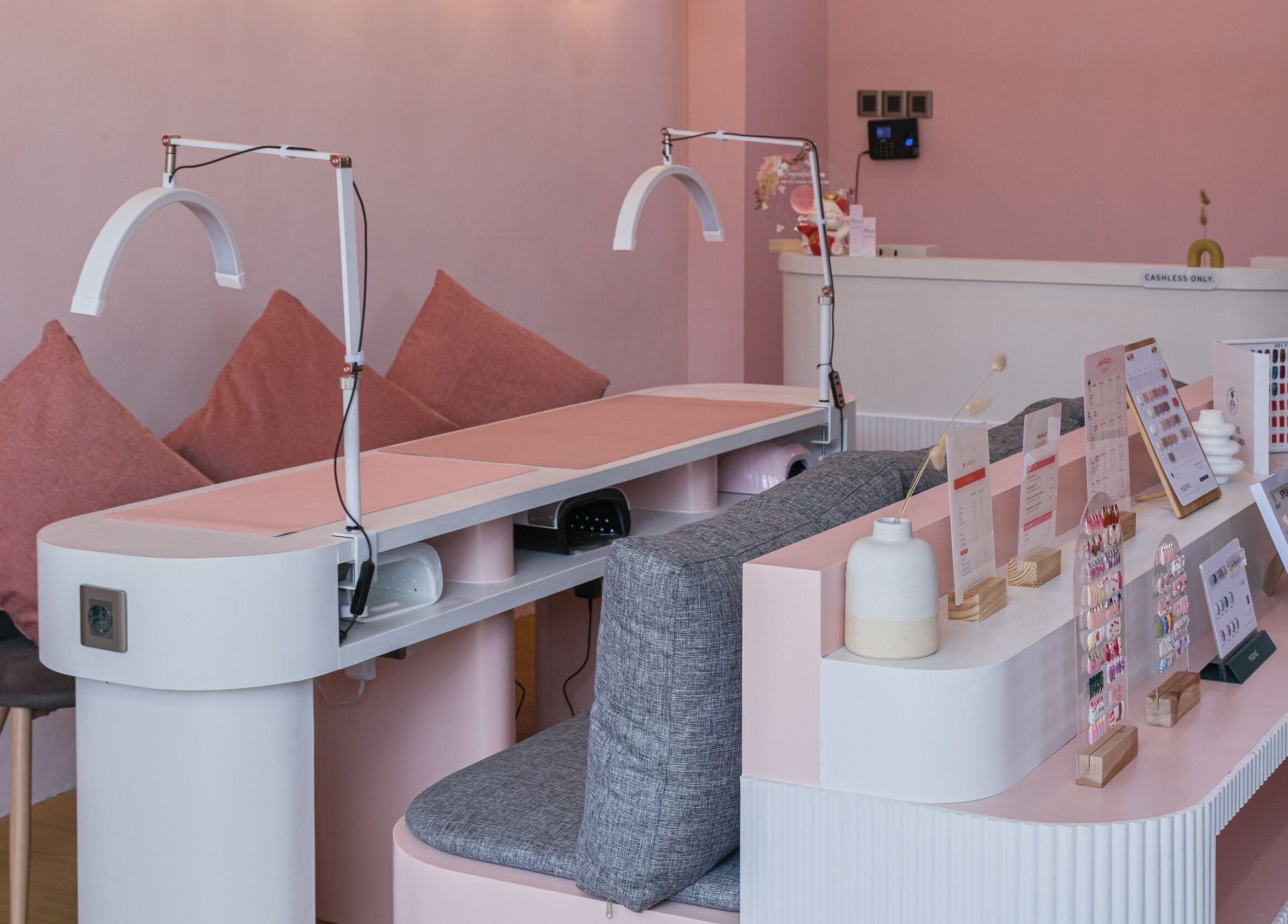 Nail salon interior at Sugarbombwax Bali featuring chic pink decor and seating in Bali, Bali, ID.