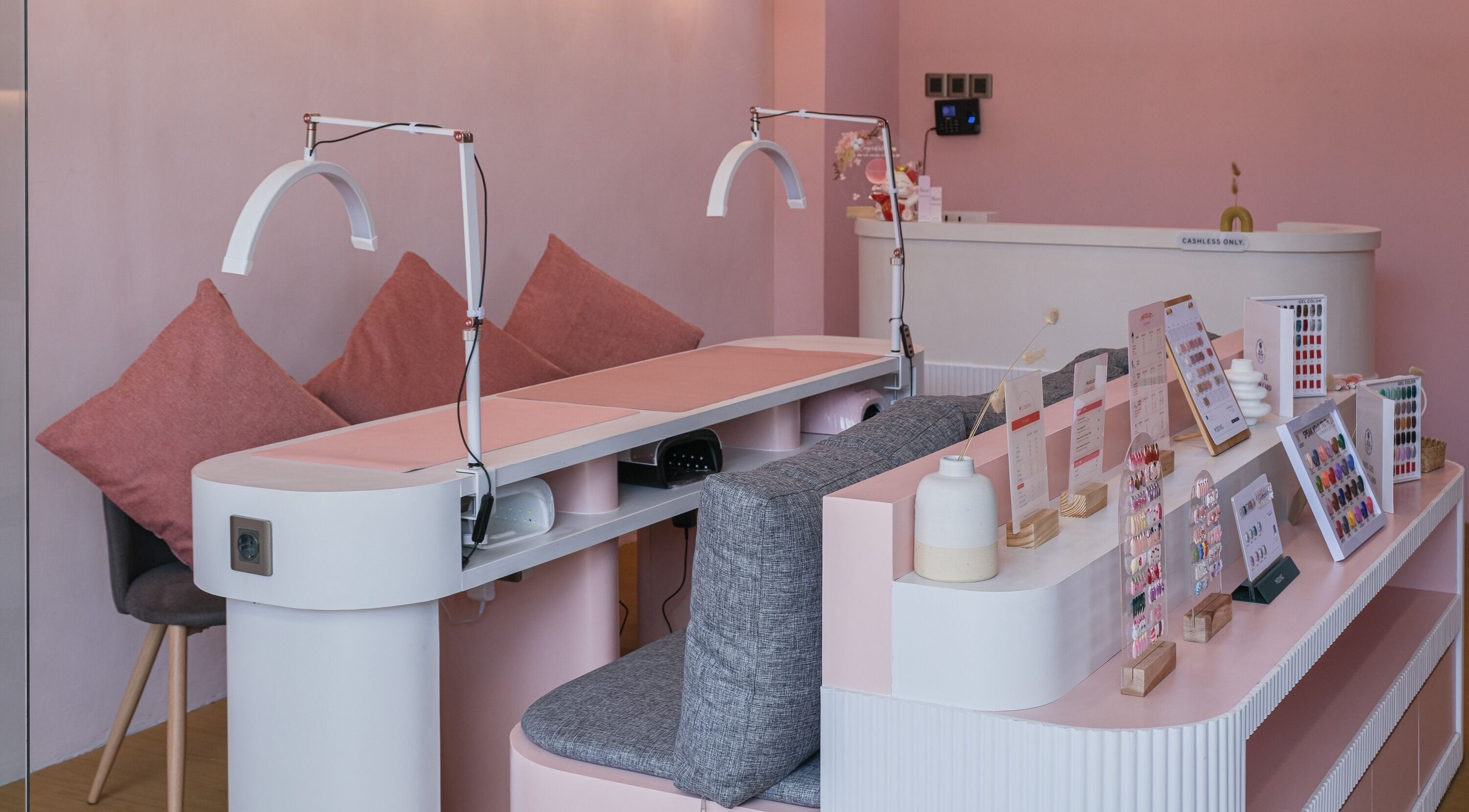 Nail salon interior at Sugarbombwax Bali featuring chic pink decor and seating in Bali, Bali, ID.
