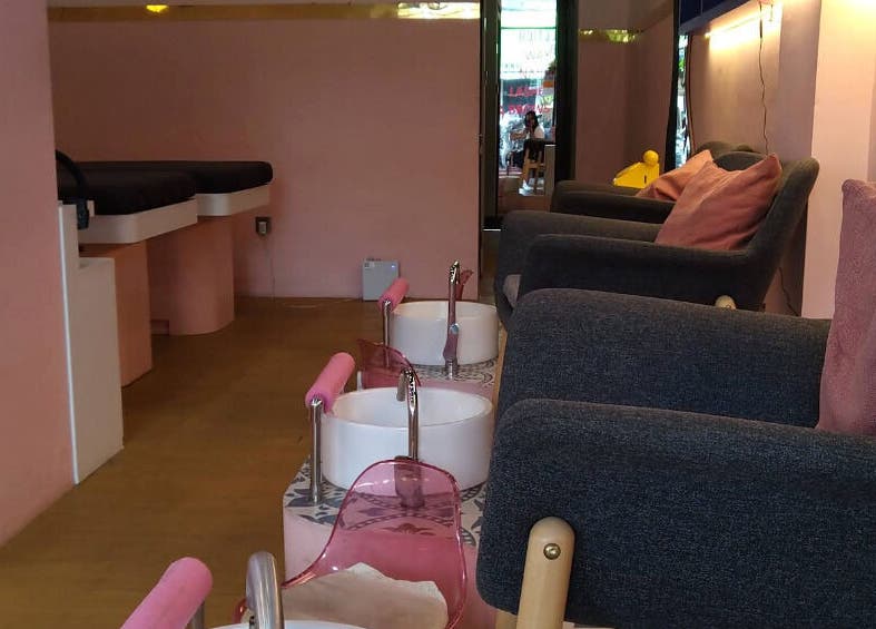 Cozy interior of Sugarbombwax Bali, featuring plush seating and pedicure stations in Bali, Bali, ID.