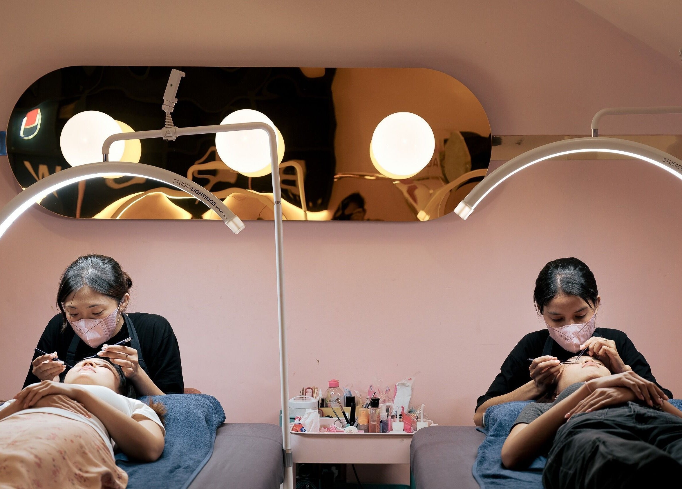 Professionals at Sugarbombwax Bali providing beauty treatments in a calm setting, Bali, Bali, ID.