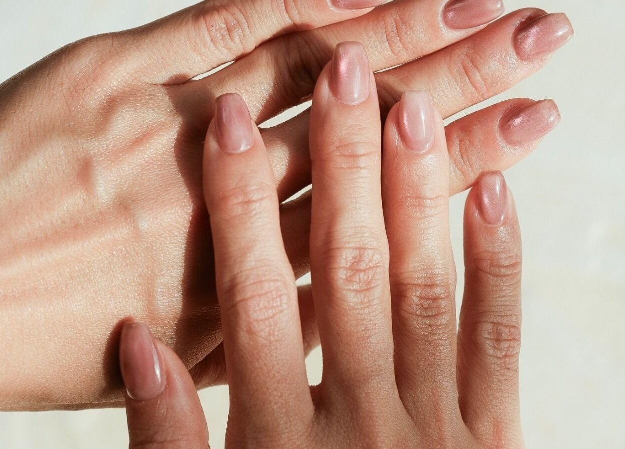 Stylish manicured nails with a glossy finish at Sugarbombwax Bali, Bali, ID offer a touch of elegance.